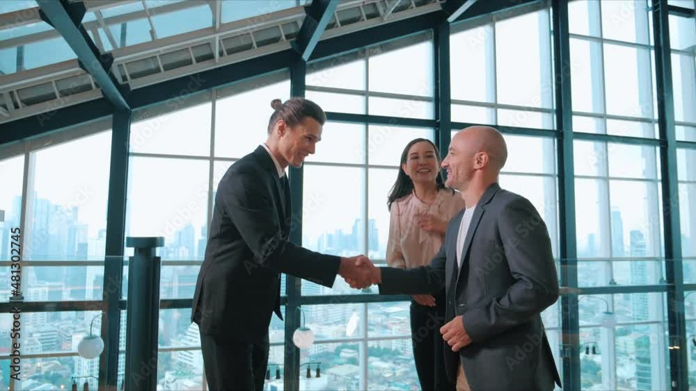 A group of business diverse people shaking hands and excited to work collaboratively with office building background in airport A group of business diverse people shaking hands and excited to work collaboratively with office building background in airport
