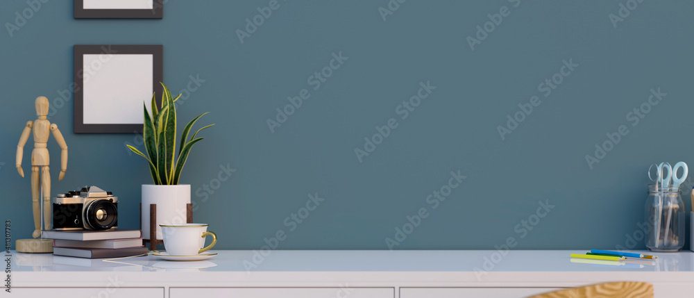 A table top with home decorations and copy space over blue wall. A table top with home decorations and copy space over blue wall.
