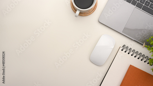 Simple office workspace with notebook laptop and copy space on white background. photo