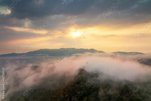 Beautiful fog in the morning forest with green mountains. Pang Puai, Mae Moh, Lampang, Thailand.