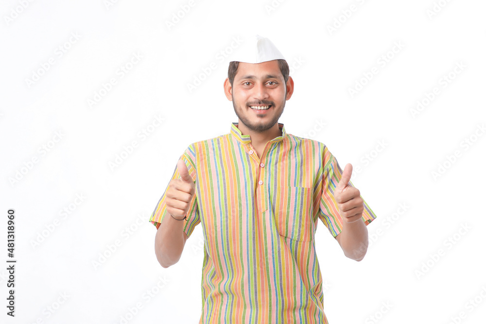 Young indian farmer in traditional wear and giving expression on white background. Young indian farmer in traditional wear and giving expression on white background.