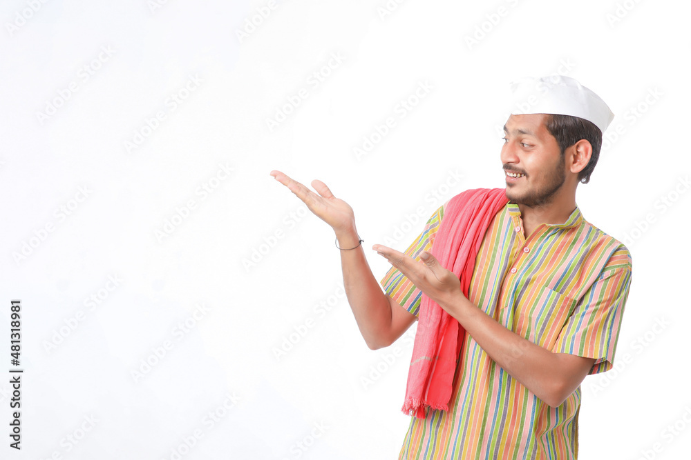 young indian man in traditional wear and showing direction on white background young indian man in traditional wear and showing direction on white background
