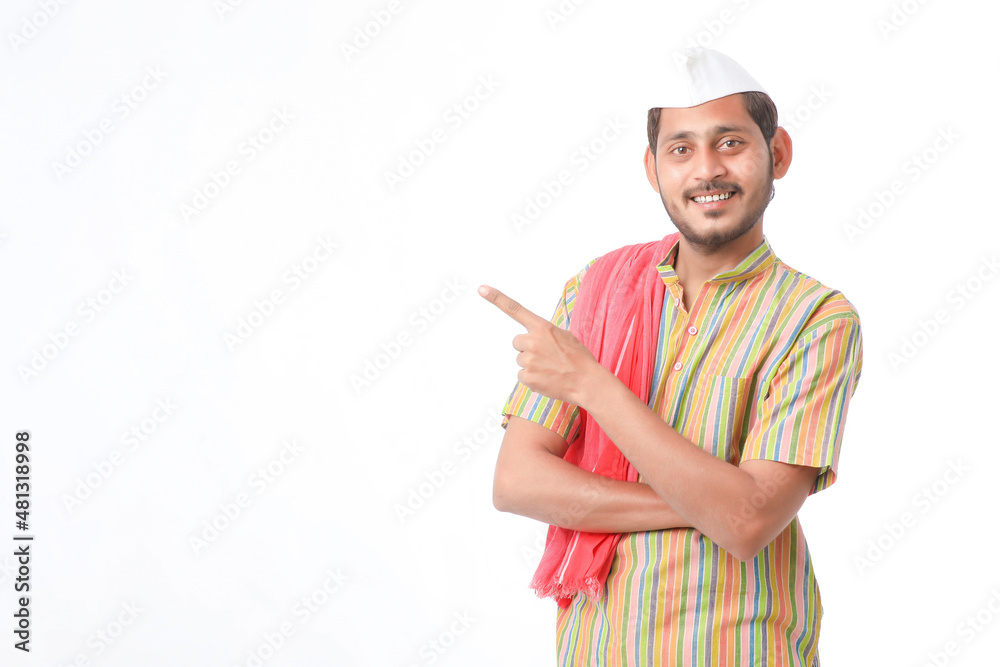 Young indian farmer in traditional wear and giving expression on white background. Young indian farmer in traditional wear and giving expression on white background.