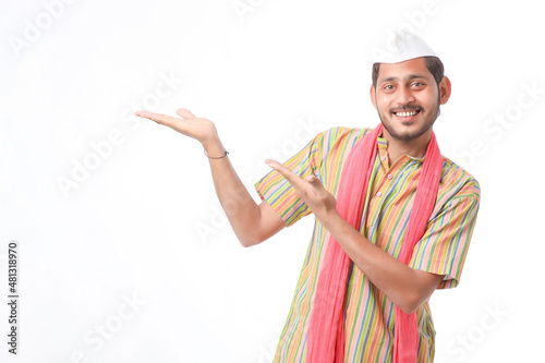 Young indian farmer in traditional wear and giving expression on white background.