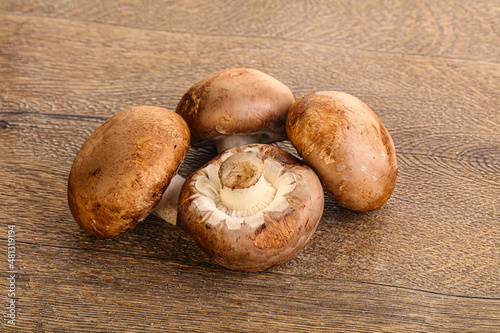 Raw brown champignons mushroom heap