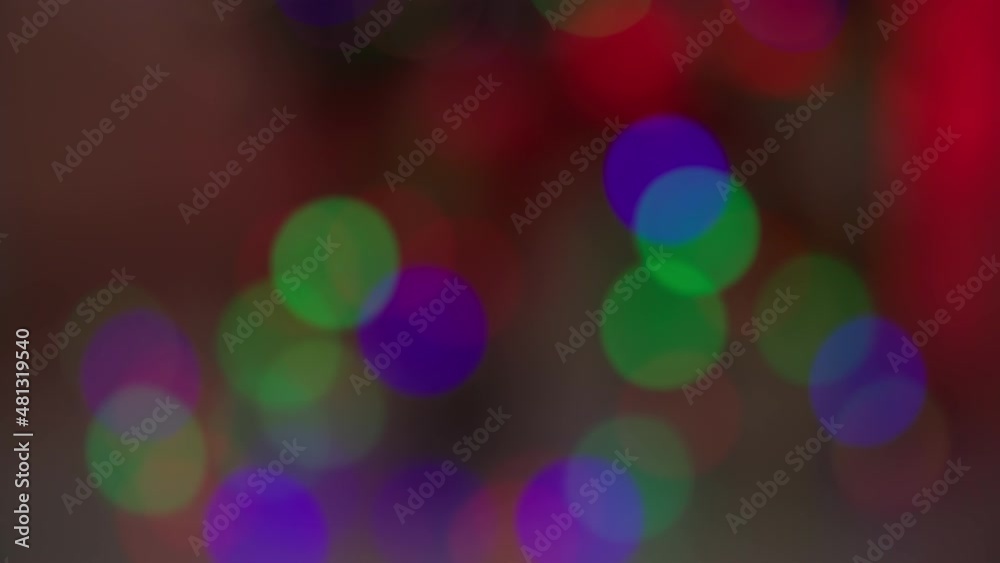 festive atmosphere, colorful lights from the garland on the Christmas tree blink and create a festive cozy atmosphere, close-up festive atmosphere, colorful lights from the garland on the Christmas tree blink and create a festive cozy atmosphere, close-up