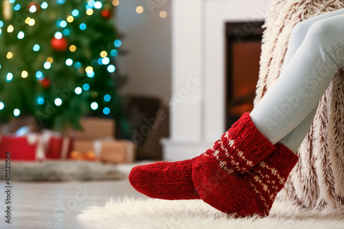 Woman in warm socks at home...