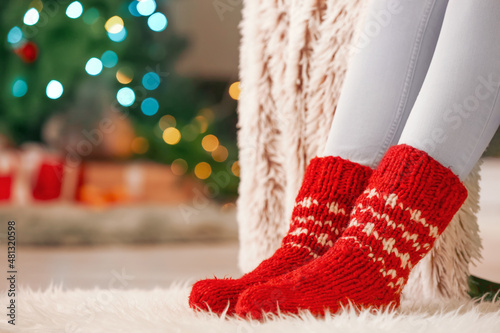 Woman in warm socks at home...