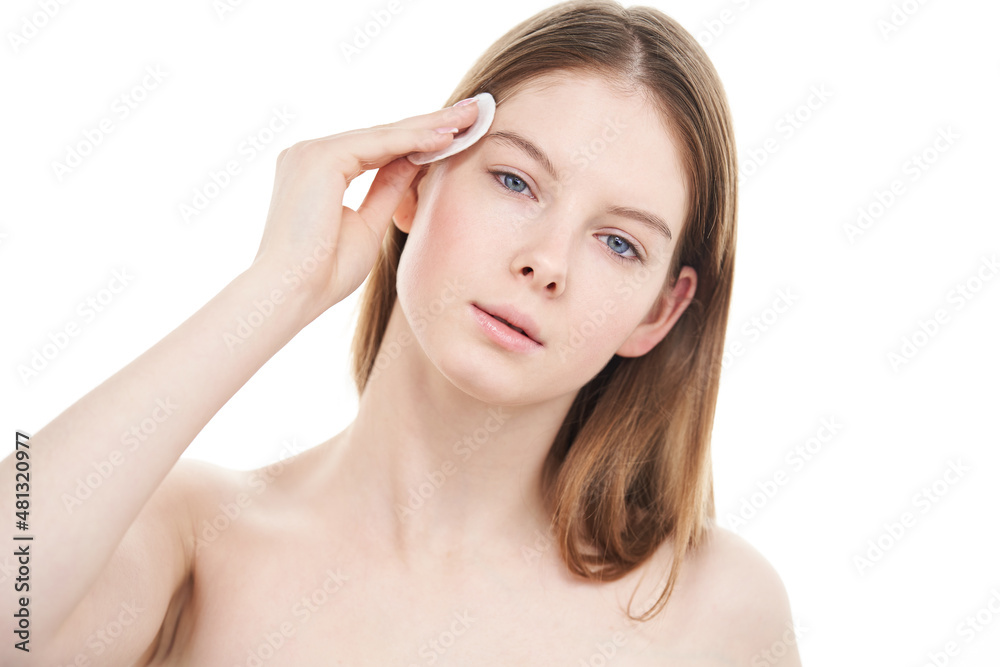 Young woman with perfect skin removes makeup from her face with cotton pad. Young woman with perfect skin removes makeup from her face with cotton pad.