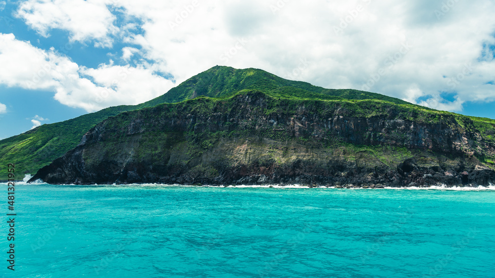 tropical island with sky and clouds