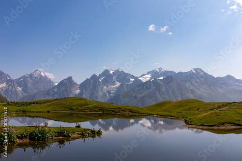 Koruldi Lakes with an amazing view on the mountain range near Mestia in the Greater Caucasus Mountain Range, Upper Svaneti, Country of Georgia. Reflection in the water. Alpine pasture. Wanderlust