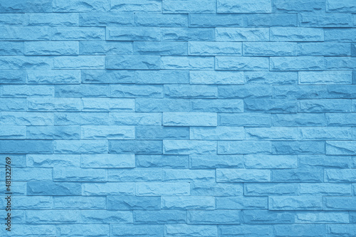 Brick wall painted with blue dark paint pastel calm tone texture background. Brickwork and stonework flooring interior backdrop.