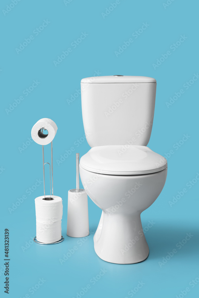 Holder with rolls of paper and toilet bowl on blue background Holder with rolls of paper and toilet bowl on blue background