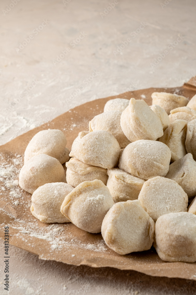 Russian homemade dumplings vertical photo. Raw ravioli. Russian homemade dumplings vertical photo. Raw ravioli.