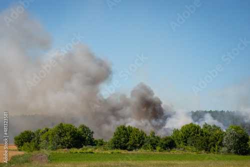 Photo of clouds of smoke coming from burning rubbish. Polluting the air with toxic gases