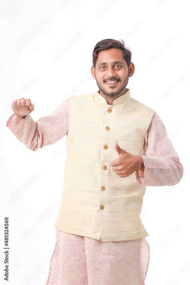 Young indian farmer in traditional wear and giving expression on white background. Young indian farmer in traditional wear and giving expression on white background.