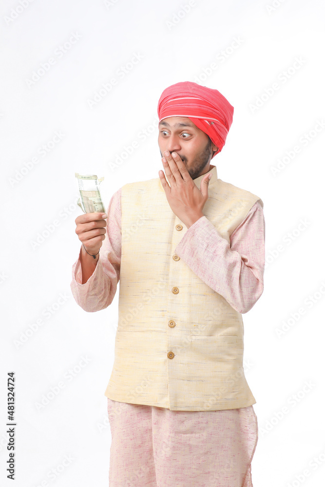 Young indian farmer showing money on white background. Young indian farmer showing money on white background.