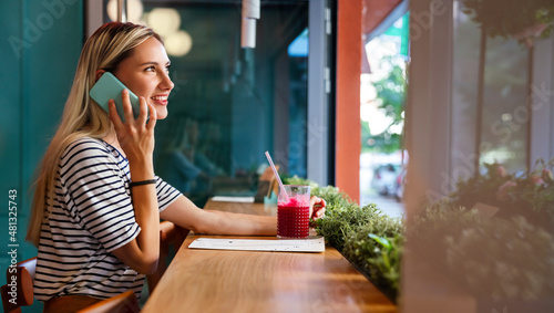 Portrait of happy young woman using smartphone. People mobile phone communication work concept © NDABCREATIVITY