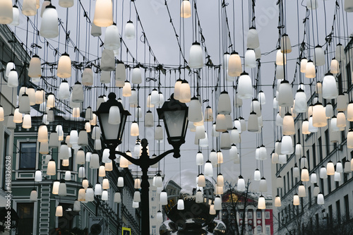 A beautiful street decorated with lanterns. Stoleshnikov Lane , Moscow photo