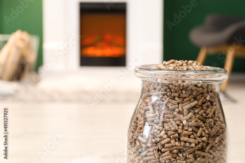 Jar with wood pellets in living room  closeup