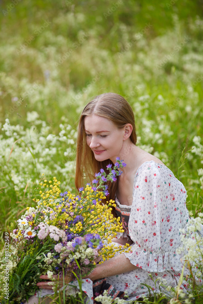 Medieval lady in historical dress. Aroma of spring nature, wild flowers, blue sky, sunshine. Medieval lady in historical dress. Aroma of spring nature, wild flowers, blue sky, sunshine.