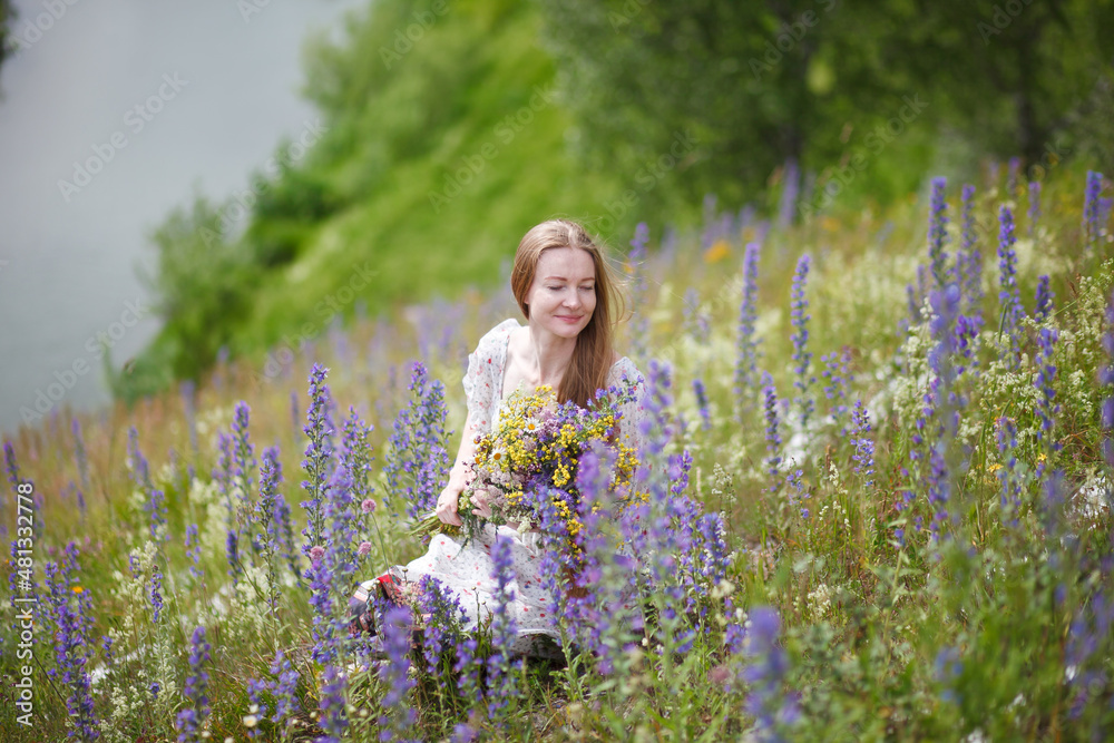 Medieval lady in historical dress. Aroma of spring nature, wild flowers, blue sky, sunshine. Medieval lady in historical dress. Aroma of spring nature, wild flowers, blue sky, sunshine.