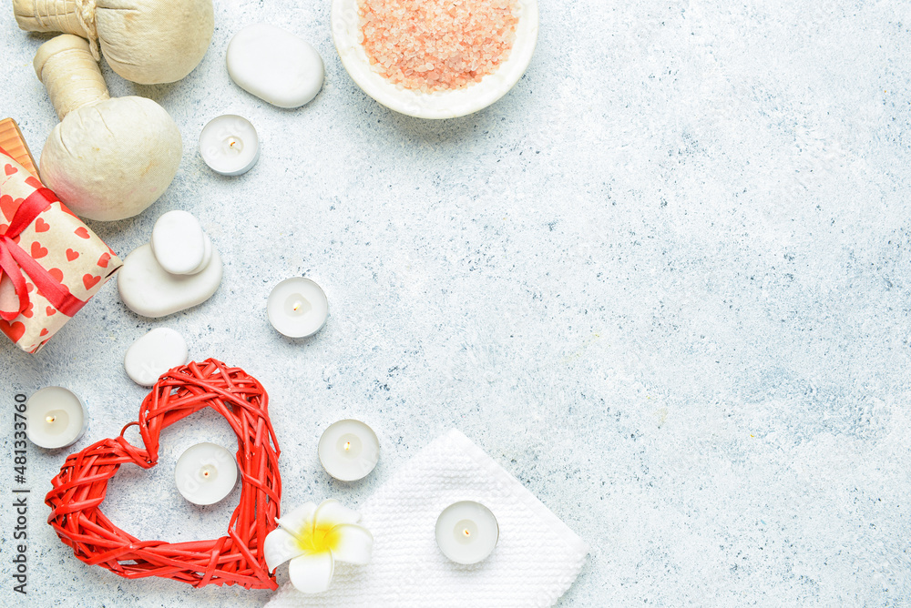 Beautiful spa composition with stones and candles for Valentine's Day celebration on light background Beautiful spa composition with stones and candles for Valentine's Day celebration on light background