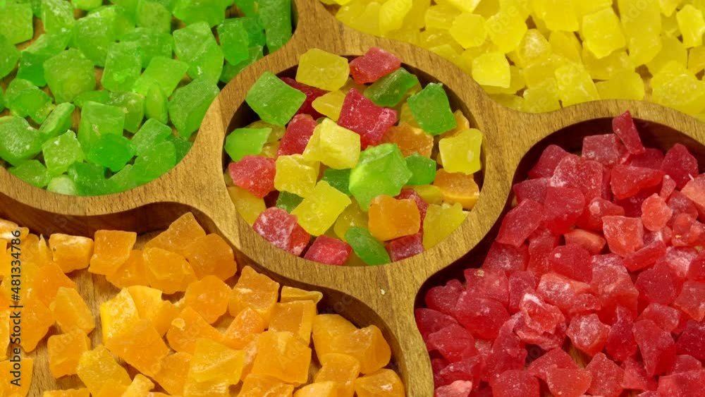 Colorful candied fruits, rotation background. Close up. Loop motion