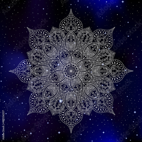 Beautiful decorative vector mandala over the space starry night sky