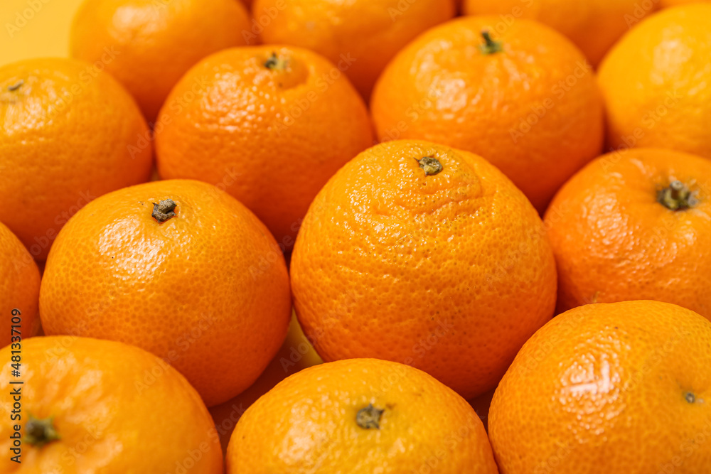 Many ripe tangerines as background, closeup Many ripe tangerines as background, closeup