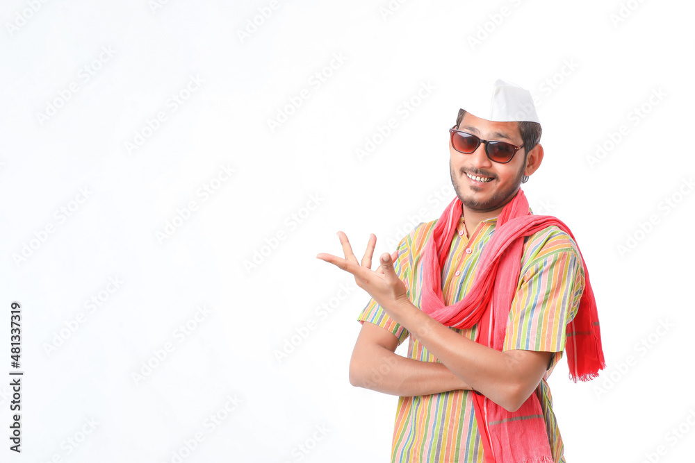 Young indian farmer in traditional wear and giving expression on white background. Young indian farmer in traditional wear and giving expression on white background.
