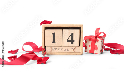 Calendar with date of Valentines Day and gift box on white background