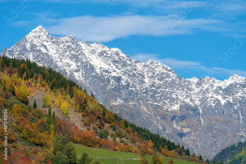 Beautiful mountain landscape, sunny autumn day with colorful trees and impressive snow peaks. Picturesque landscapes of the Caucasus mountains, Svaneti, Georgia