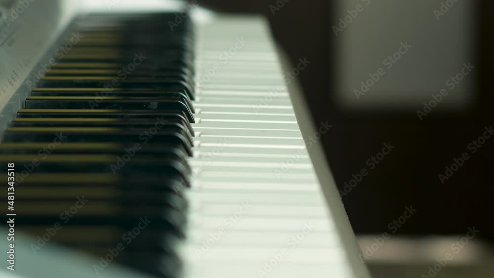 The theme of learning to play the piano child. Listening exam in music school. The child repeats the notes on the piano after the teacher.Music school lesson master class.Selective focus The theme of learning to play the piano child. Listening exam in music school. The child repeats the notes on the piano after the teacher.Music school lesson master class.Selective focus