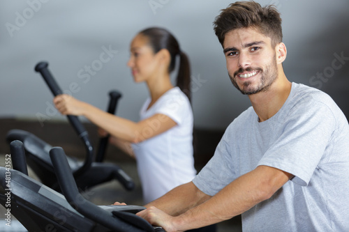 people running in machine treadmill at fitness gym club