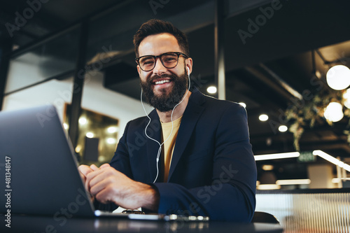 Successful entrepreneur smiling at the camera in an office photo