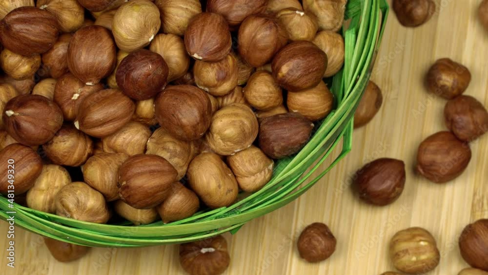 Hazelnuts in a basket, rotation background. Close up Hazelnuts in a basket, rotation background. Close up