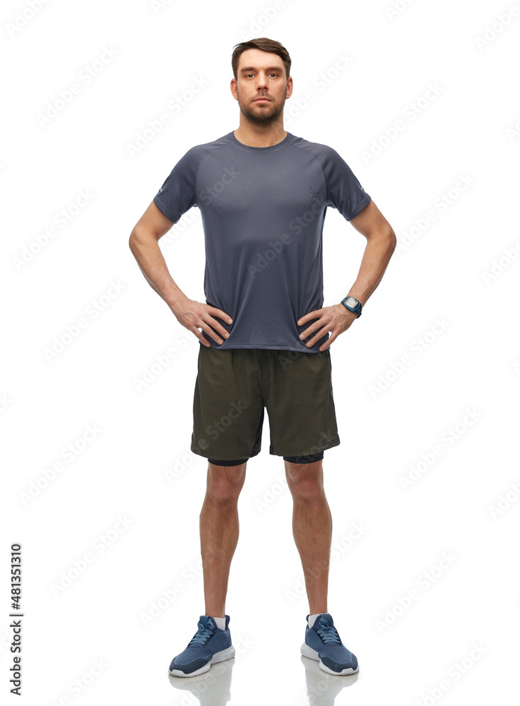 fitness, sport and healthy lifestyle concept - man in sports clothes with smart watch or tracker over white background fitness, sport and healthy lifestyle concept - man in sports clothes with smart watch or tracker over white background
