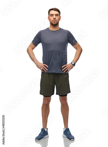 fitness, sport and healthy lifestyle concept - man in sports clothes with smart watch or tracker over white background