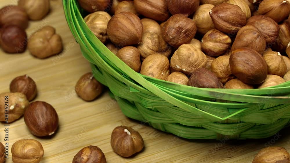 Hazelnuts in a basket, rotation background. Close up Hazelnuts in a basket, rotation background. Close up