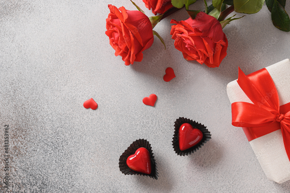 Valentine's day two heart shaped chocolate sweets, romantic gift, red roses. View from above. Copy space. Valentine's day two heart shaped chocolate sweets, romantic gift, red roses. View from above. Copy space.