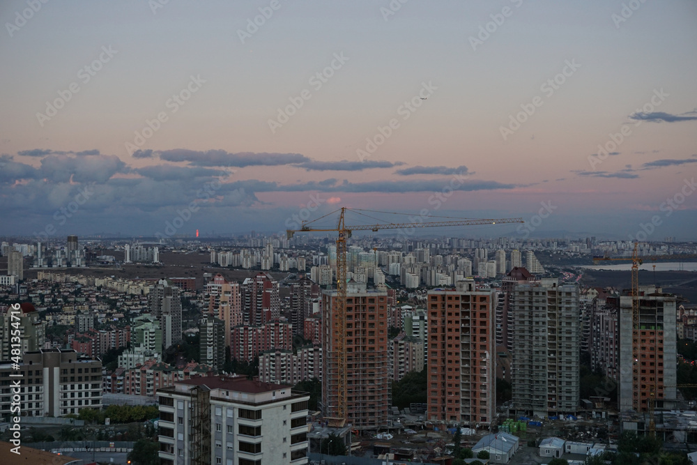 skyscraper, constructions and crane in istanbul Başakşehir, sunset