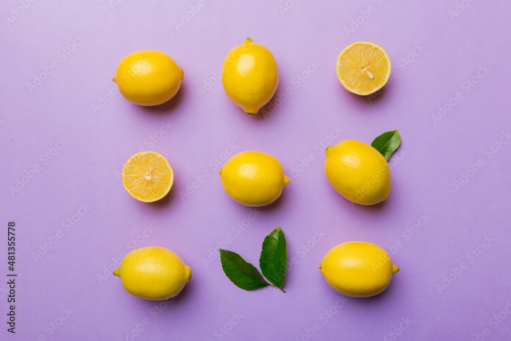 Many fresh ripe lemons as colored background, top view. Elegant background of lemon and lemon slices Top view flat lay Many fresh ripe lemons as colored background, top view. Elegant background of lemon and lemon slices Top view flat lay