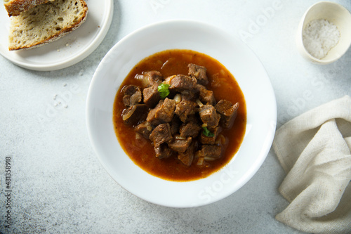 Traditional homemade beef goulash served with bread