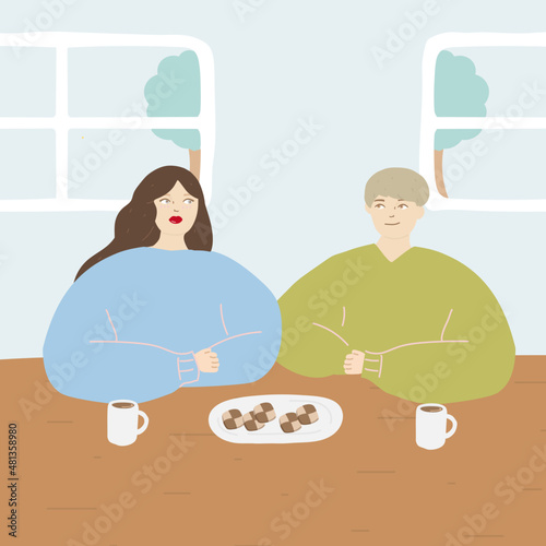 部屋で　クッキーを食べながら　談笑している　男と女