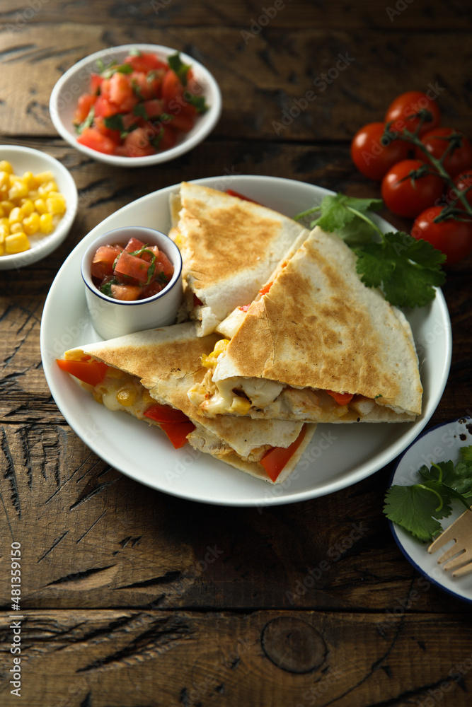 Homemade quesadilla with chicken and tomatoes Homemade quesadilla with chicken and tomatoes