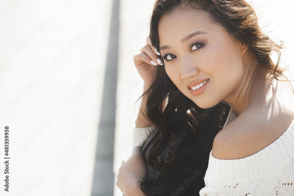 Beautiful woman outdoors. Pretty lady on urban background. Asian female closeup portrait. Beautiful woman outdoors. Pretty lady on urban background. Asian female closeup portrait.