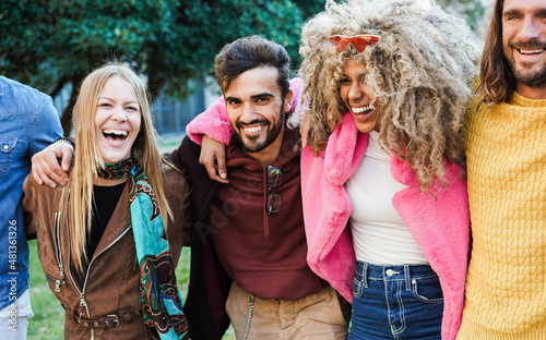 Young multiracial people having fun at city park - Focus on african girl face