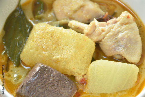 spicy boiled slice winter melon with chicken and blood in coconut milk green curry soup on bowl