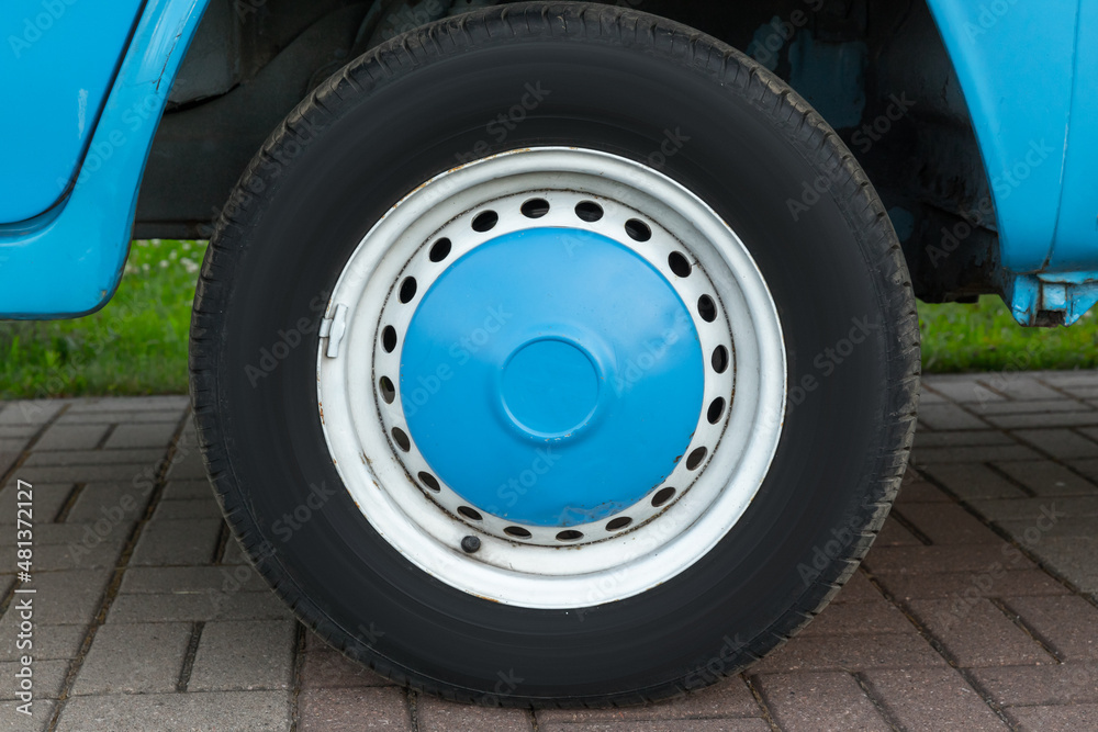 Closeup photo of blue white car wheel